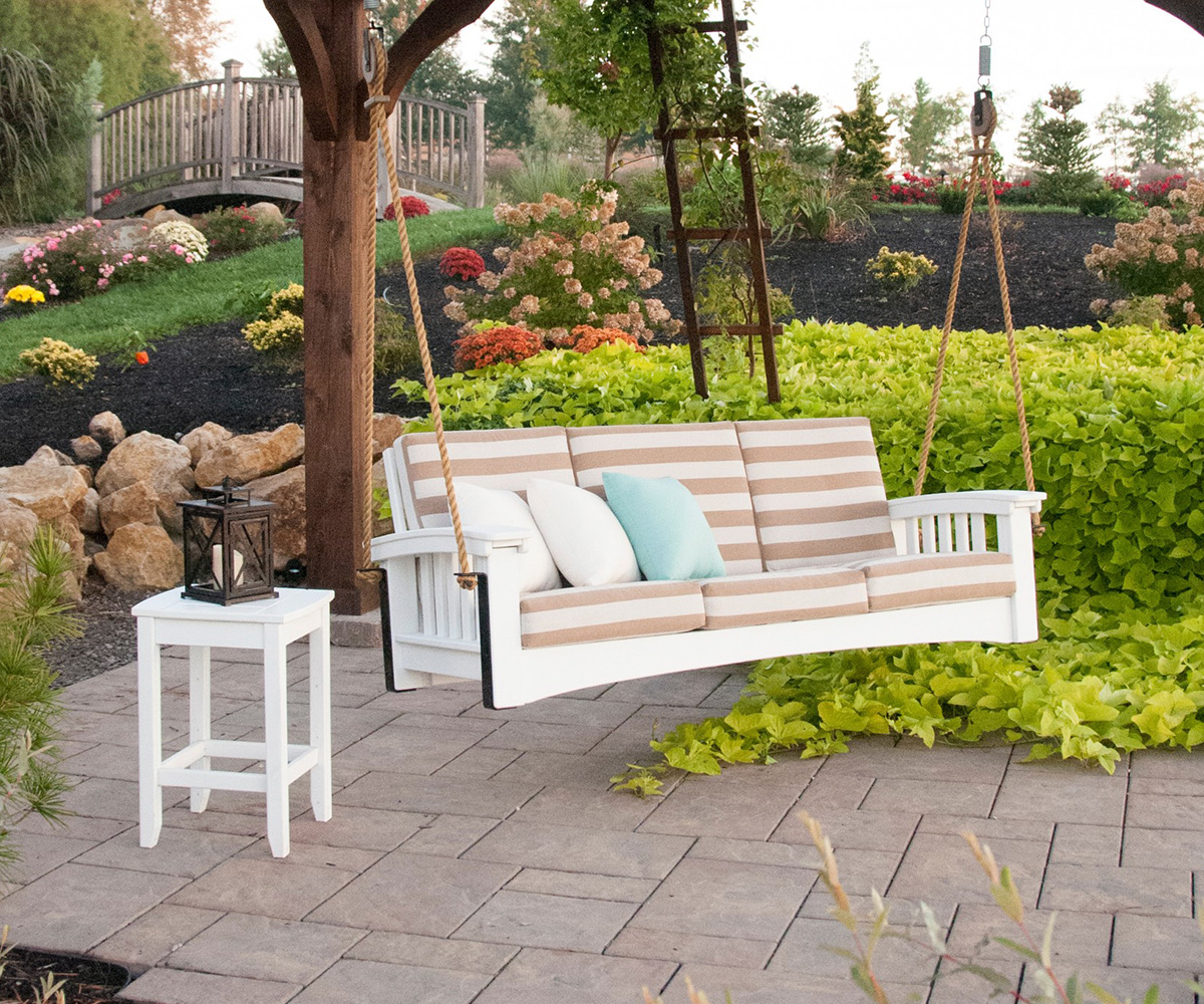 Porch swing with cushions, remove upholstery for winter to prevent moisture damage.