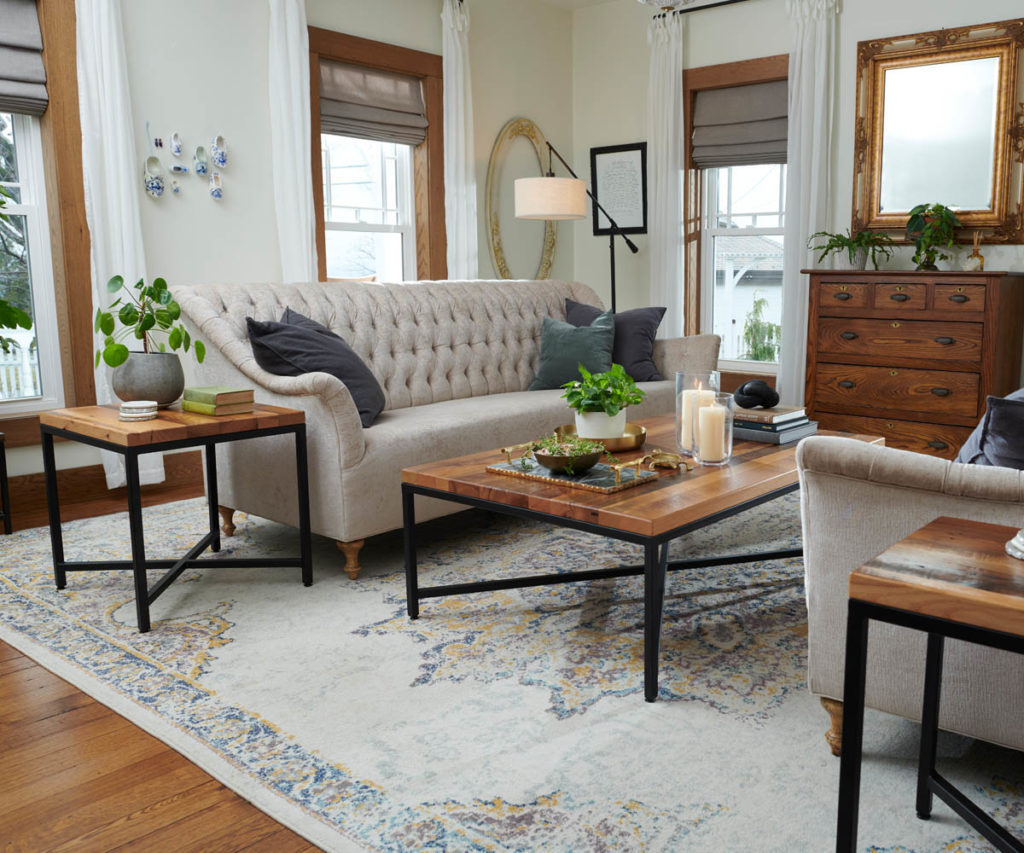 Amish furniture for farmhouse style living room with tufted sofa and solid-wood tables.