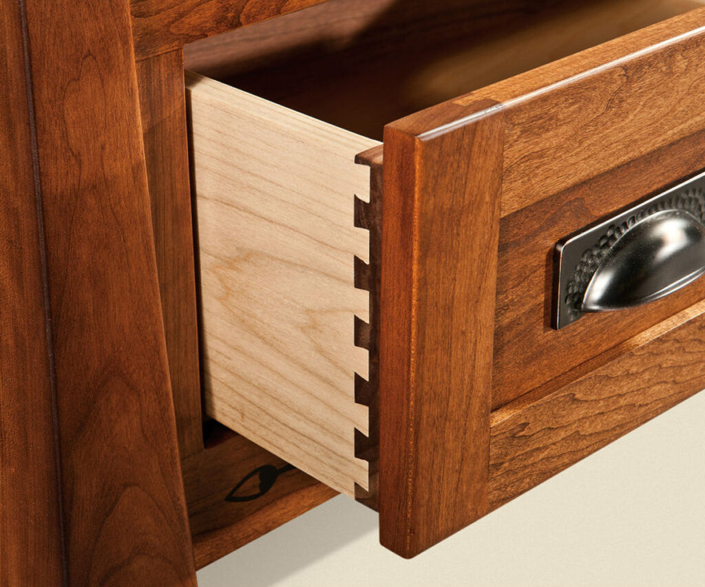 Dovetail drawer joinery on solid wood Amish dresser drawer.